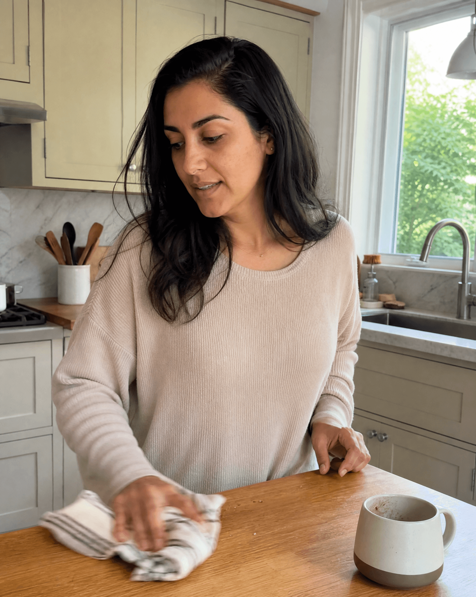 Yusra working in her kitchen